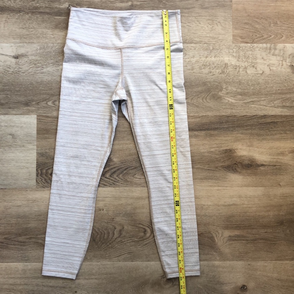 Athleta Leggings In a tan and white textured pattern. - Picture 3 of 13